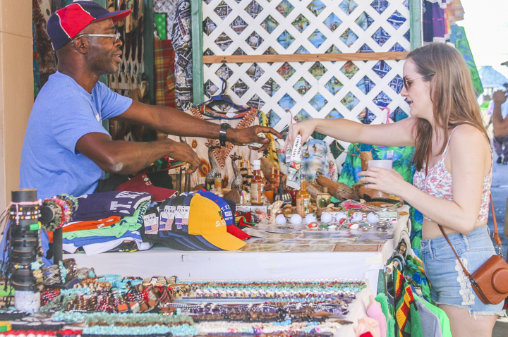 Cruise Passenger purchasing locally crafted products.
