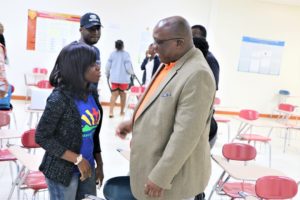 Prime Minister Harris chats with a Nigerian student