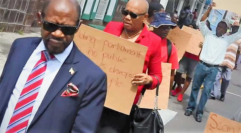 AS HISTORIC TENURE OF OFFICE OF PRIME MINISTER BILL TABLED, LEADER OF ST. KITTS-NEVIS OPPOSITION LEADS PROTEST OUTSIDE PARLIAMENT