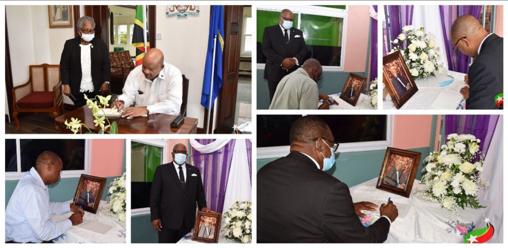 PRIME MINISTER HARRIS SIGNS BOOK OF CONDOLENCE FOR THE LATE RICHARD CAINES